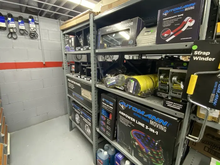 Stocked shelves of Automann truck parts at Fleet Maintenance